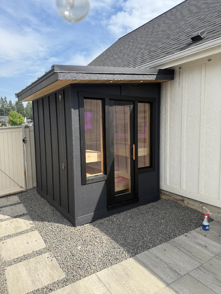 Board-and-batten custom sauna by day