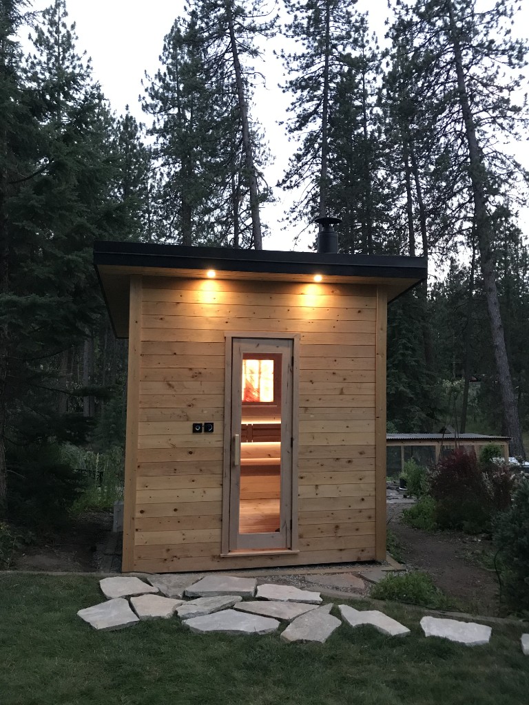 Forest cabin sauna at dusk