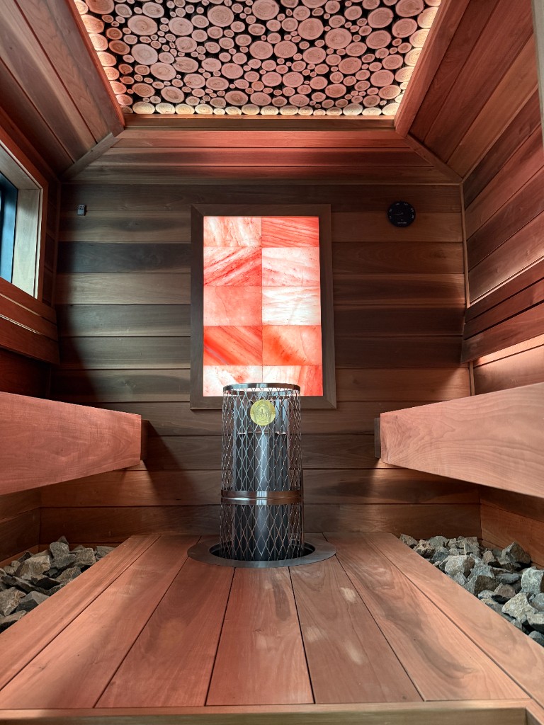 Artisanal wood-cookie ceiling detail with salt wall and ambient lighting